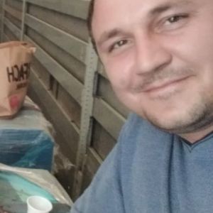 николай